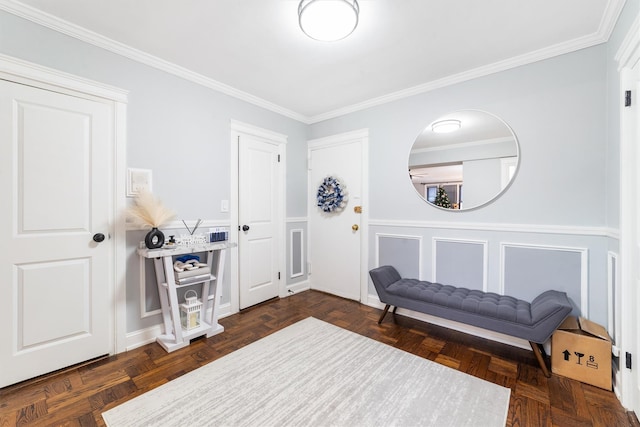 sitting room featuring dark parquet floors and crown molding