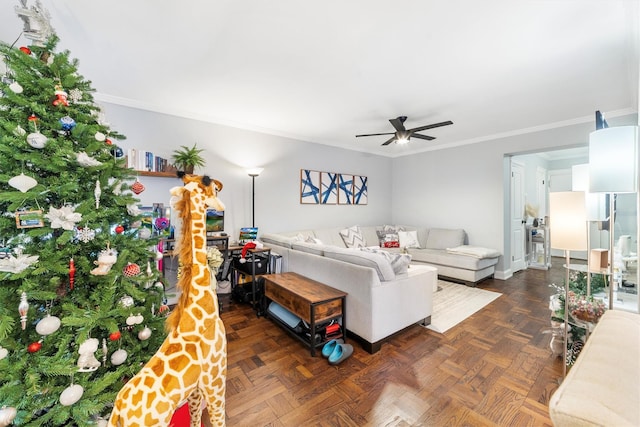 living room featuring ceiling fan, dark parquet flooring, and crown molding