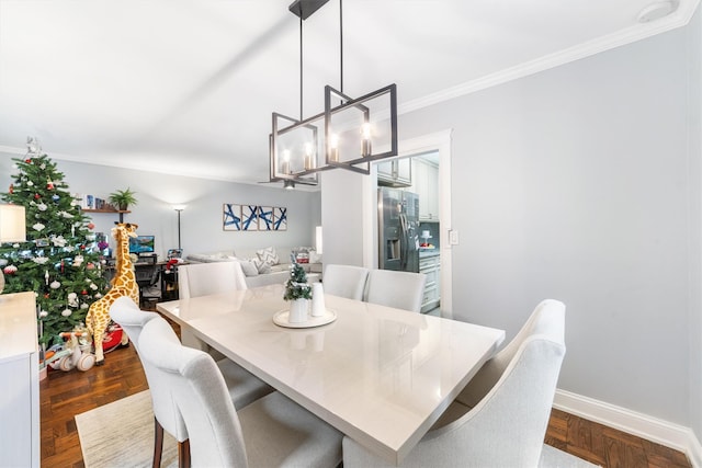 dining area with crown molding, dark hardwood / wood-style floors, and a notable chandelier