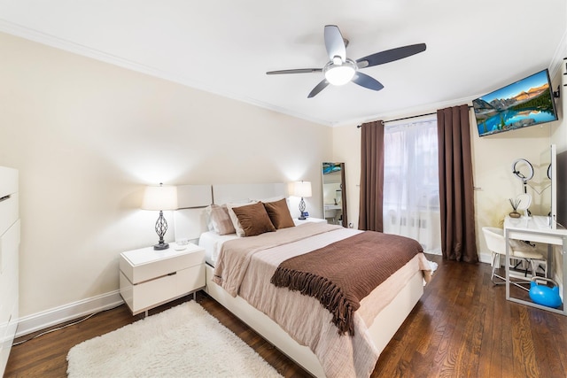 bedroom with dark hardwood / wood-style flooring, ceiling fan, and ornamental molding