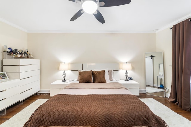 bedroom with ceiling fan, crown molding, and dark wood-type flooring