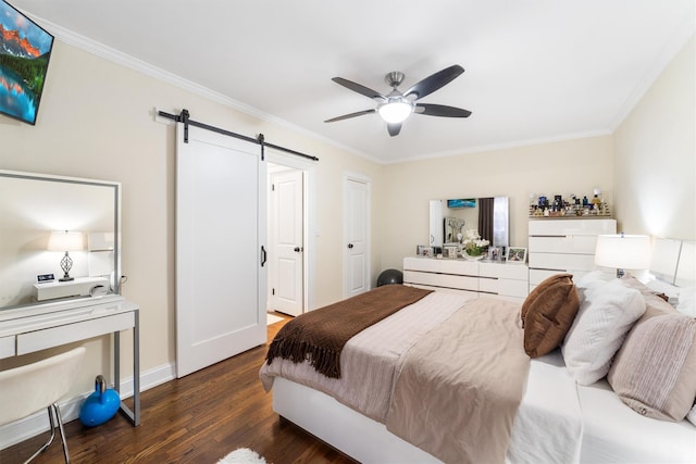 bedroom with ceiling fan, a barn door, ornamental molding, and dark wood-type flooring