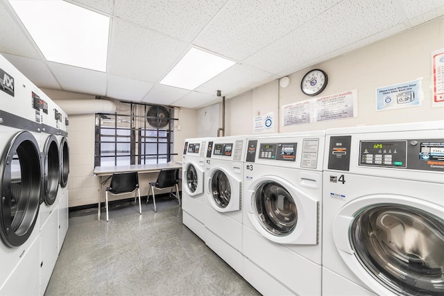 clothes washing area featuring independent washer and dryer