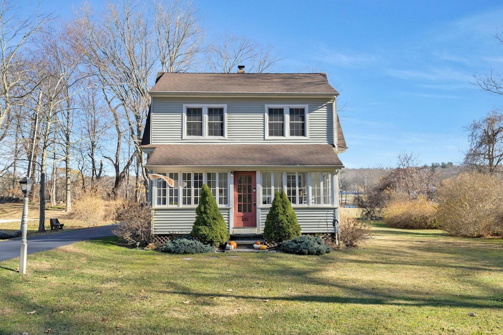 front facade with a front lawn