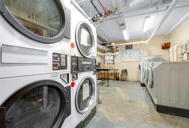 clothes washing area featuring separate washer and dryer and stacked washer / drying machine