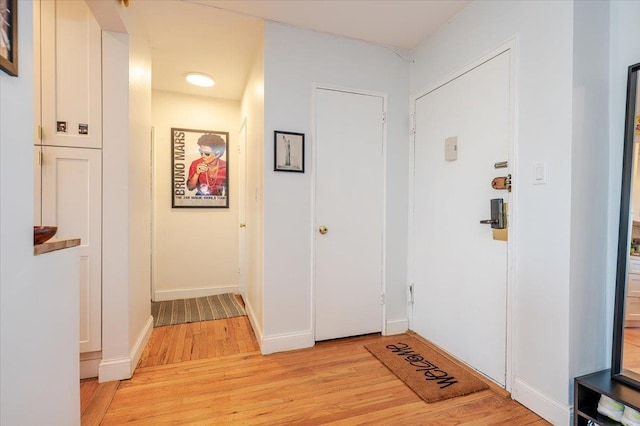 hallway with light wood-type flooring