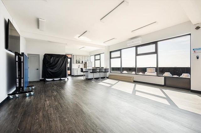 interior space featuring a wall mounted air conditioner and hardwood / wood-style floors