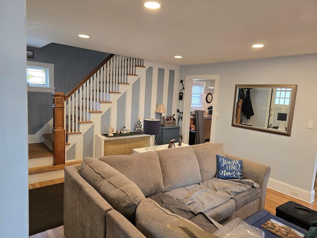 living room with hardwood / wood-style floors and a healthy amount of sunlight