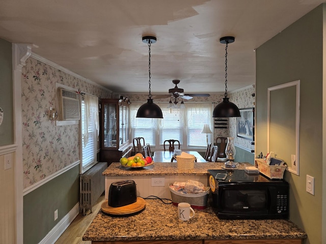 kitchen with ceiling fan, radiator heating unit, light hardwood / wood-style flooring, decorative light fixtures, and ornamental molding