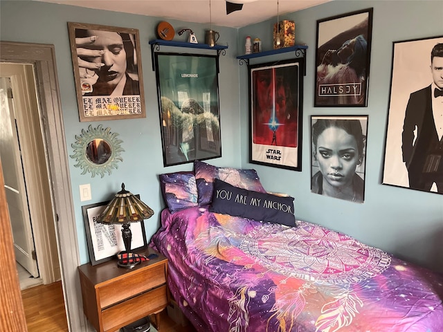 bedroom with wood-type flooring