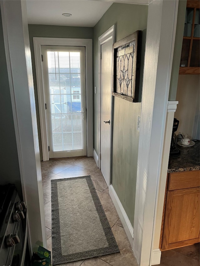 entryway with light tile patterned flooring