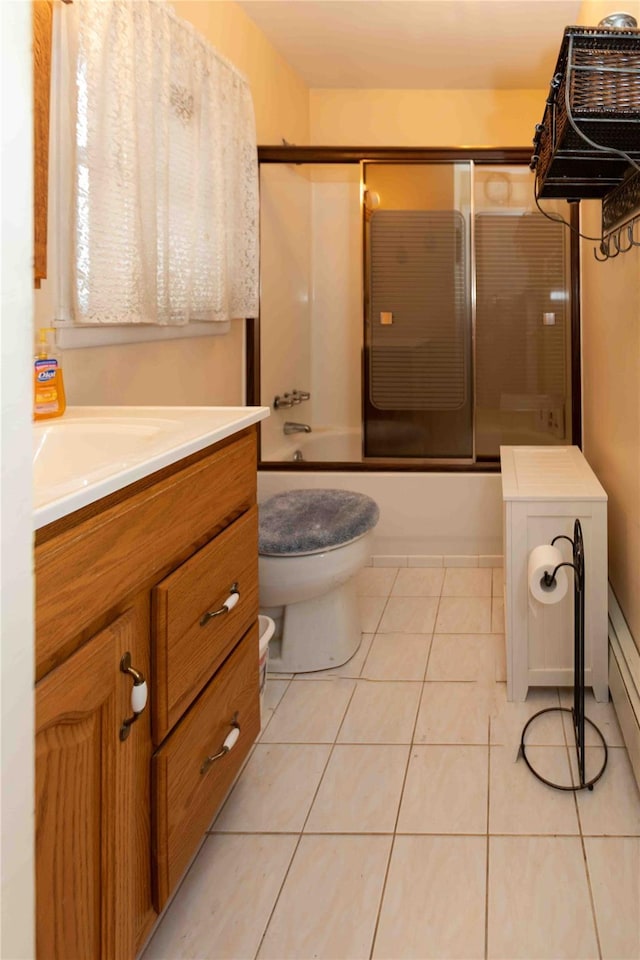 full bathroom with tile patterned flooring, vanity, toilet, and enclosed tub / shower combo