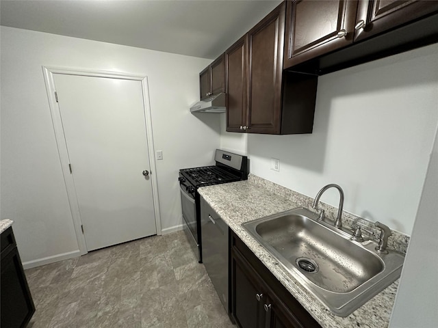 kitchen featuring dark brown cabinetry, sink, and appliances with stainless steel finishes