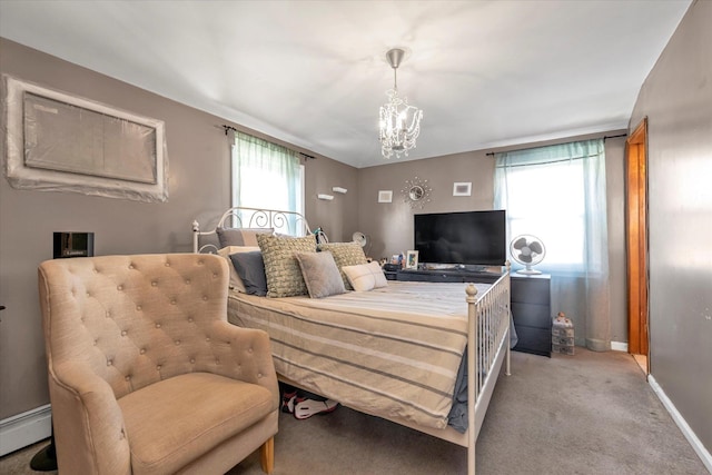 bedroom featuring baseboard heating, light carpet, and a chandelier