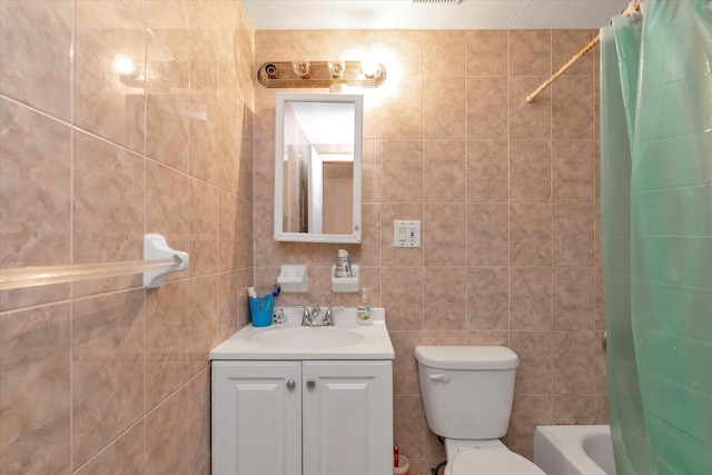 full bathroom featuring shower / bath combo, vanity, toilet, and tile walls