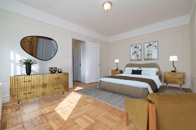 bedroom featuring light parquet flooring