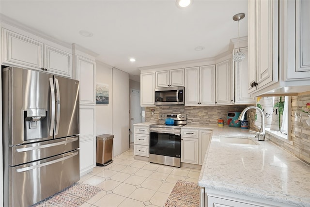 kitchen featuring white cabinets, sink, tasteful backsplash, light stone counters, and stainless steel appliances