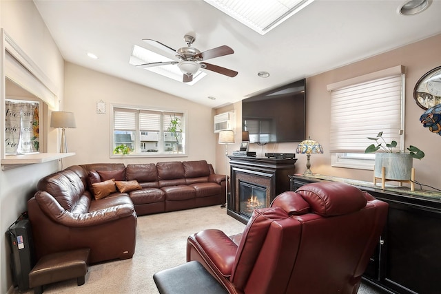 carpeted living room with a wall unit AC, ceiling fan, and vaulted ceiling