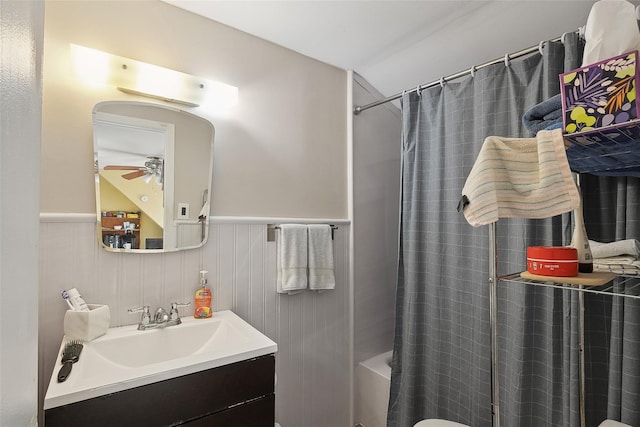 bathroom with vanity, ceiling fan, and shower / tub combo with curtain