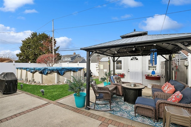 view of patio featuring a gazebo, an outdoor living space, and a covered pool