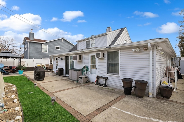 rear view of house featuring a gazebo and a patio area