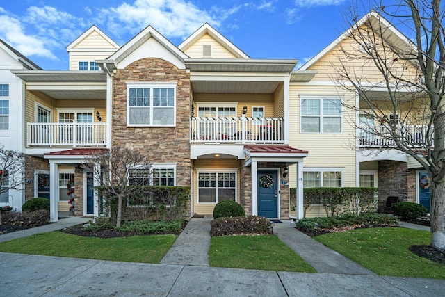 multi unit property featuring a balcony