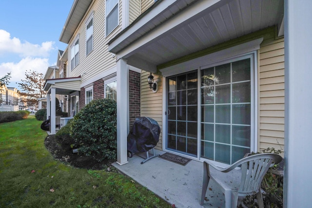 entrance to property with a yard