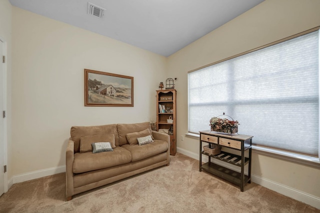 living area with light colored carpet