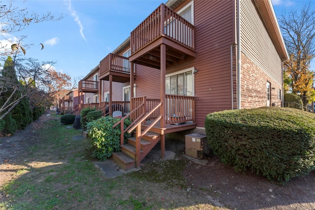 rear view of property featuring a balcony