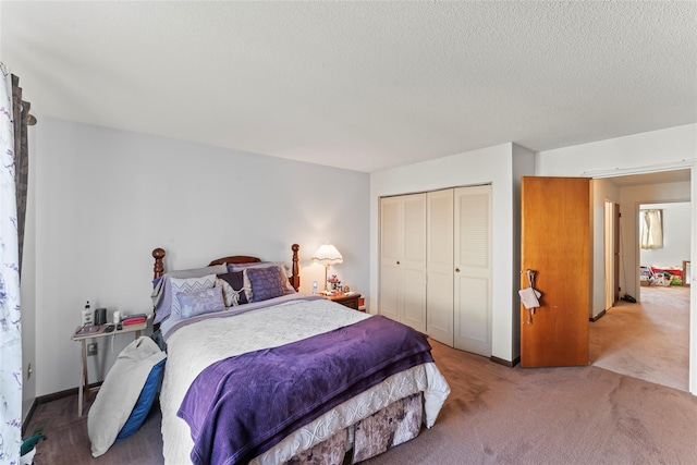 carpeted bedroom featuring a closet and a textured ceiling