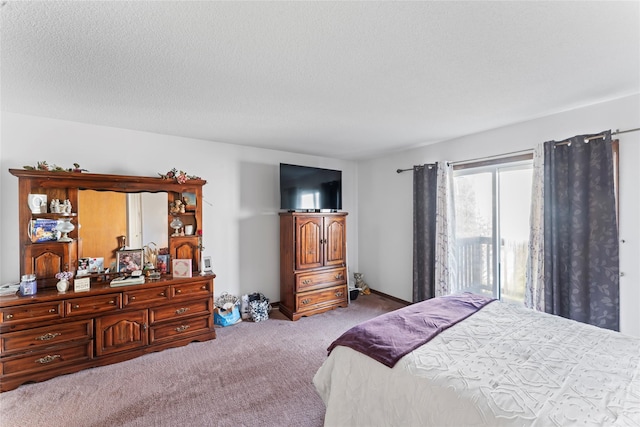 bedroom featuring a textured ceiling and light carpet