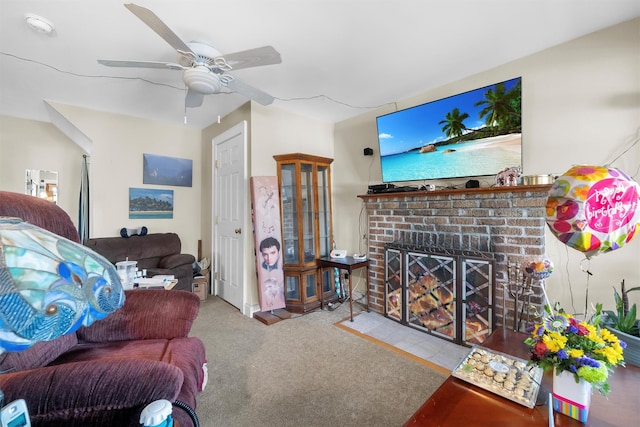 living room with ceiling fan, light colored carpet, and a fireplace