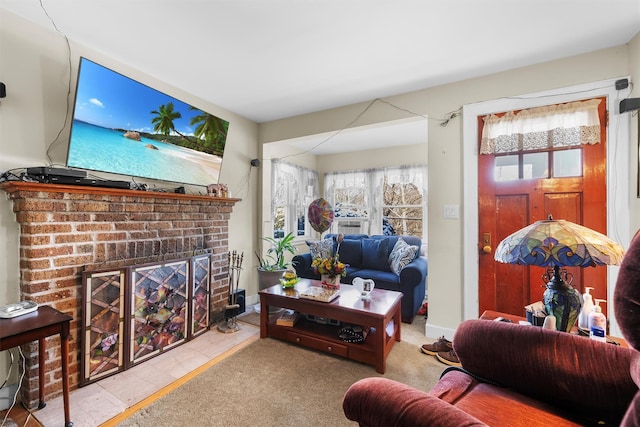 carpeted living room with a brick fireplace