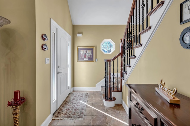 foyer entrance with light tile patterned floors