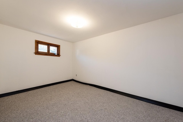 spare room featuring carpet