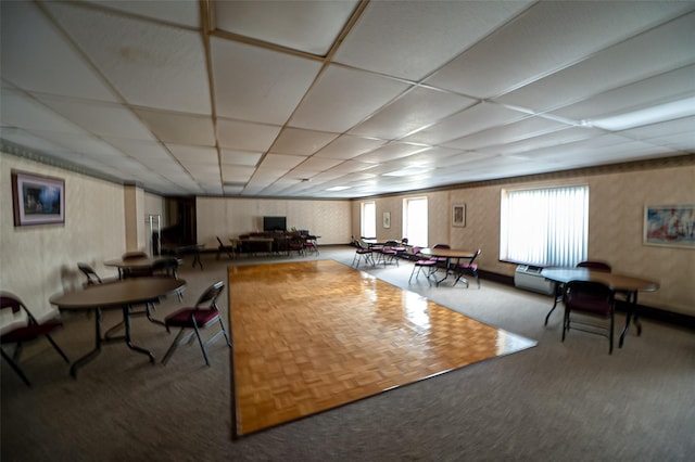 135 Post Ave Unit 5U, Westbury, NY 11590 - living area featuring a paneled ceiling and carpet