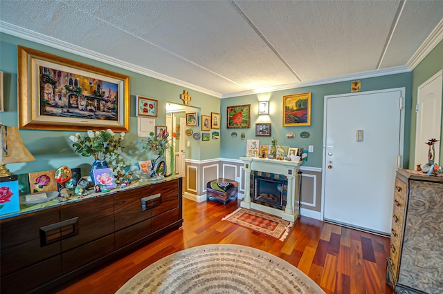 135 Post Ave Unit 5U, Westbury, NY 11590 - living area with wood finished floors, a textured ceiling, ornamental molding, wainscoting, and a stone fireplace