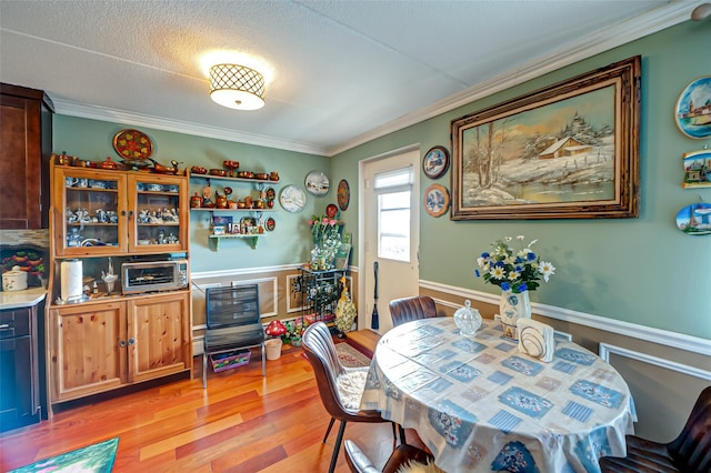 135 Post Ave Unit 5U, Westbury, NY 11590 - dining room featuring crown molding and light wood finished floors