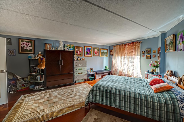 135 Post Ave Unit 5U, Westbury, NY 11590 - bedroom featuring crown molding, a textured ceiling, and wood finished floors
