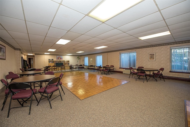 135 Post Ave Unit 5U, Westbury, NY 11590 - carpeted dining room featuring a drop ceiling and plenty of natural light