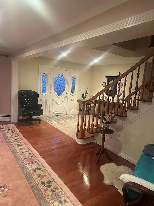 interior space featuring wood-type flooring and a baseboard radiator