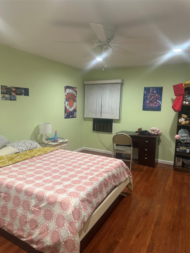 bedroom with ceiling fan and dark hardwood / wood-style flooring