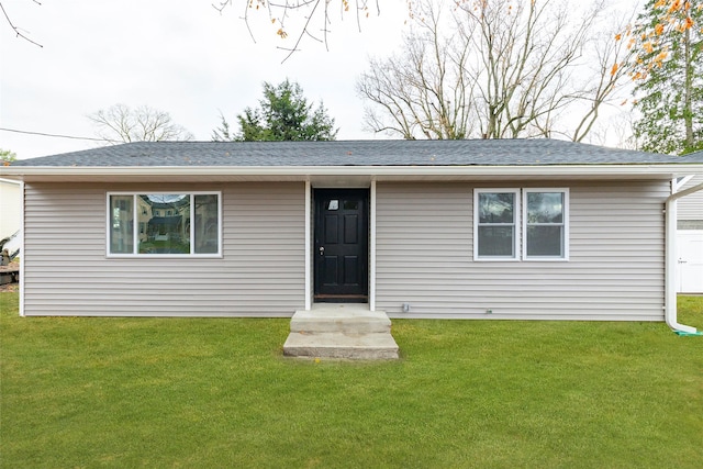 view of front of property with a front lawn