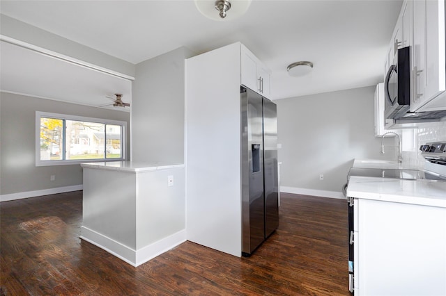 kitchen featuring white cabinetry, ceiling fan, stainless steel appliances, tasteful backsplash, and dark hardwood / wood-style floors