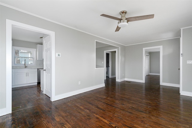 unfurnished room with dark hardwood / wood-style floors, ceiling fan, ornamental molding, and sink