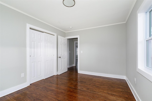 unfurnished bedroom with multiple windows, crown molding, and dark hardwood / wood-style flooring