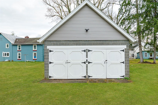 garage featuring a lawn