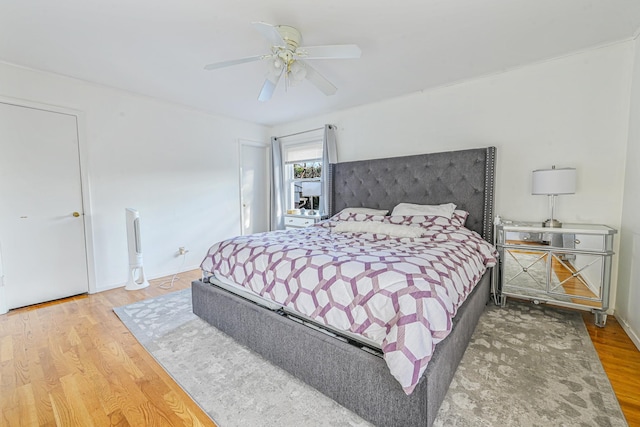 bedroom featuring wood-type flooring and ceiling fan