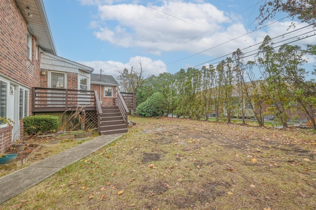 view of yard with a deck