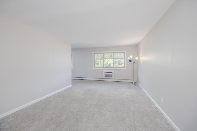 carpeted spare room featuring a wall mounted AC